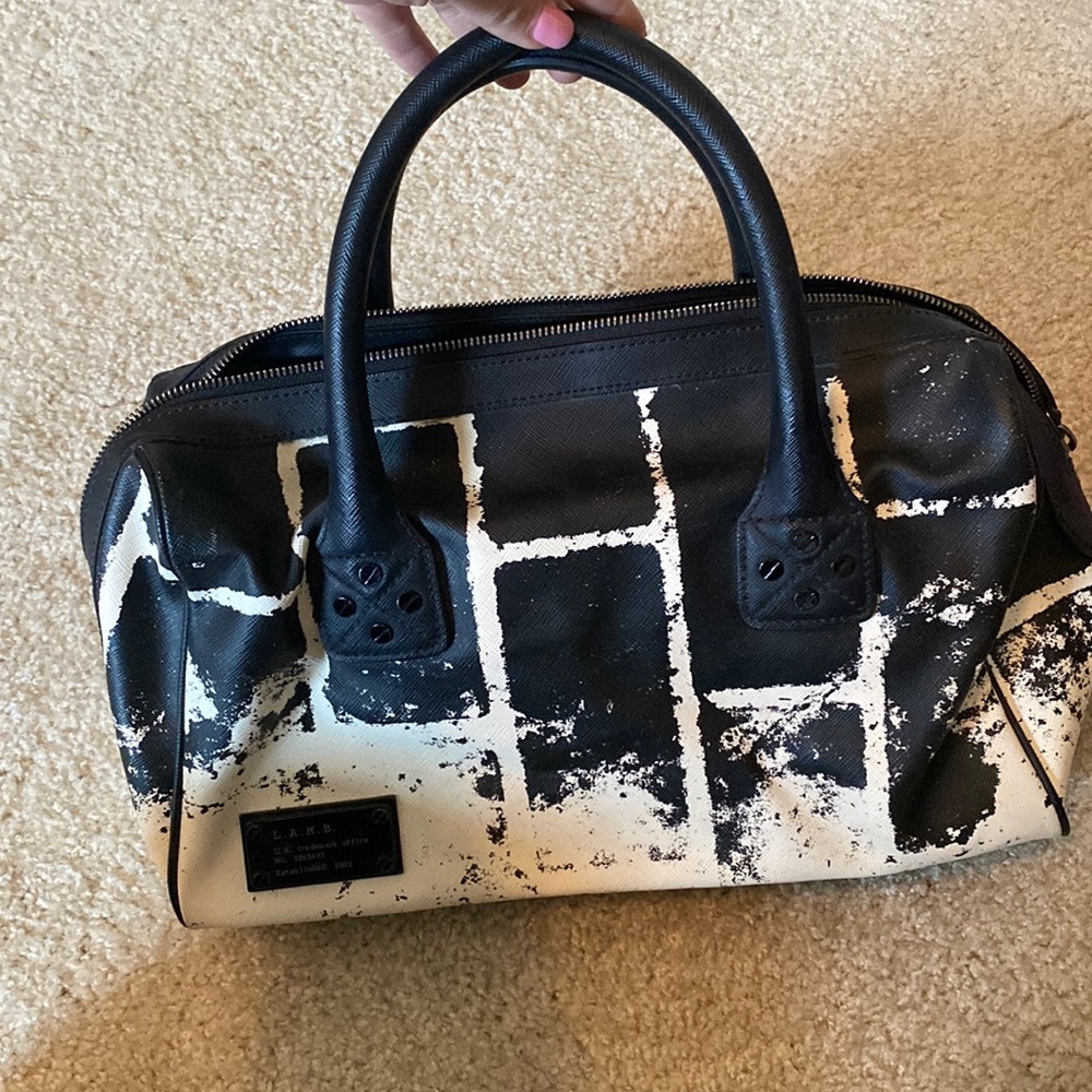 LAMB purse. Black & white leather design. Short handles. Black & white interior
